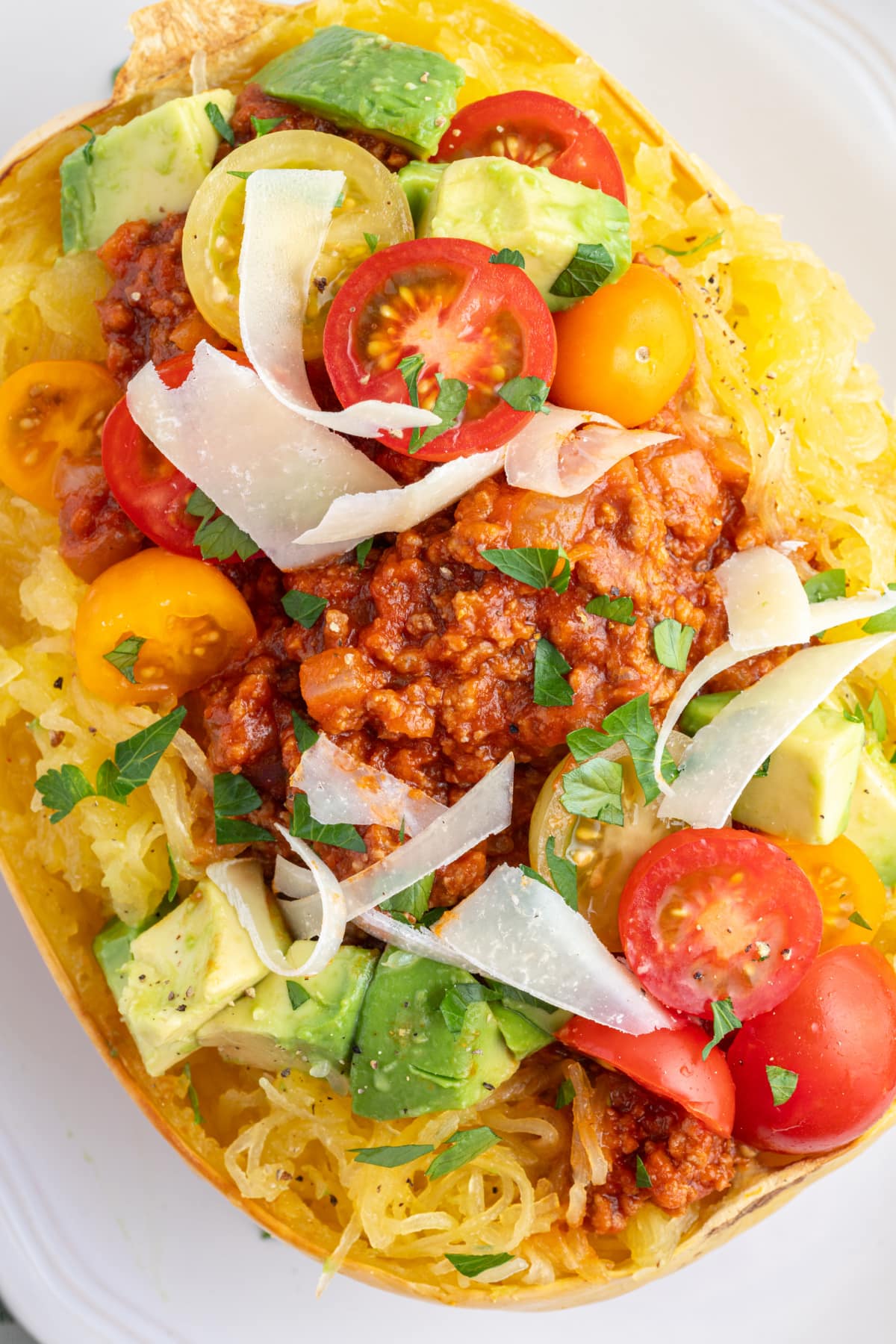 spaghetti squash with spicy meat sauce avocado and tomato