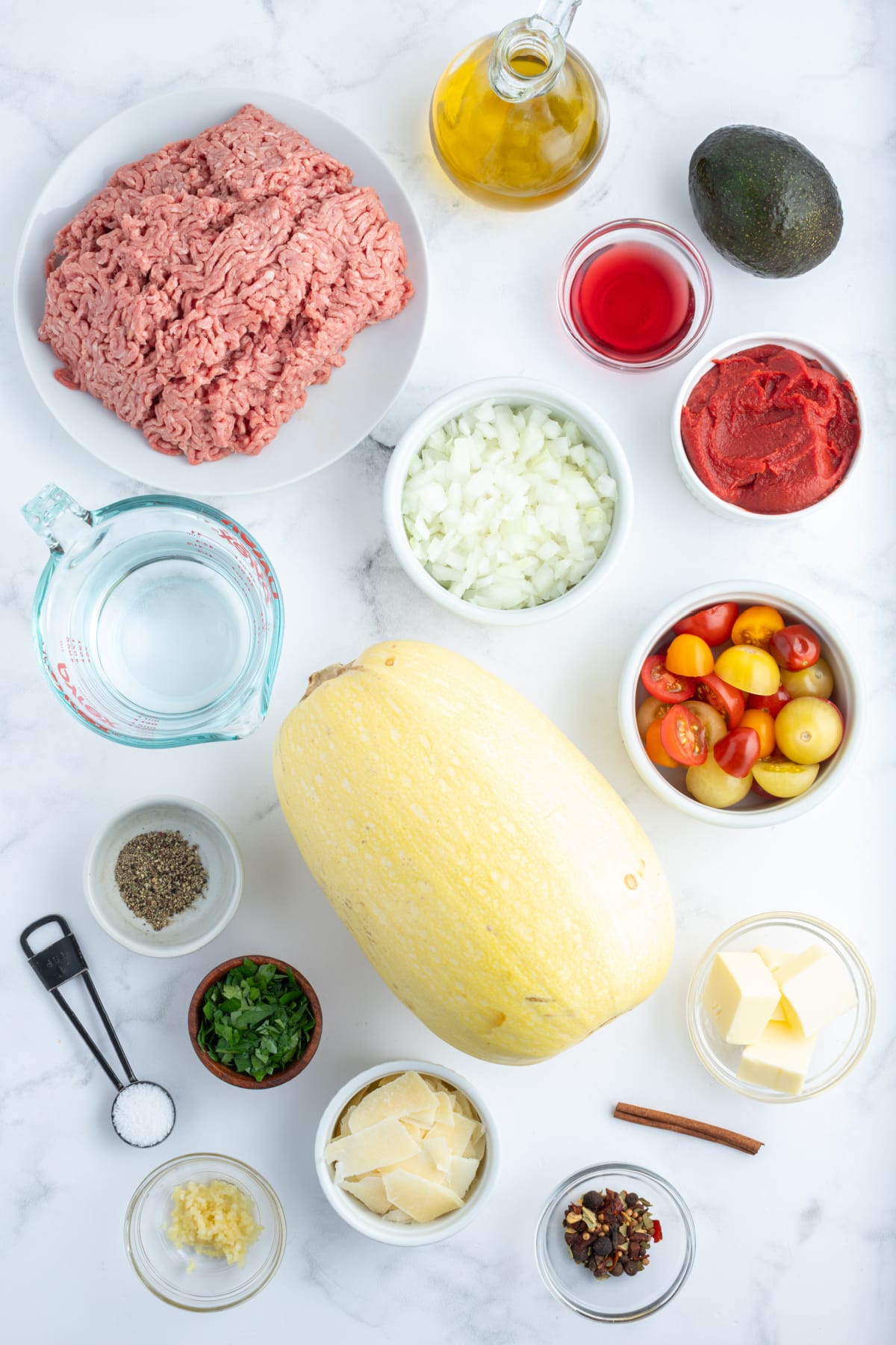 ingredients displayed for making spaghetti squash with spicy meat sauce