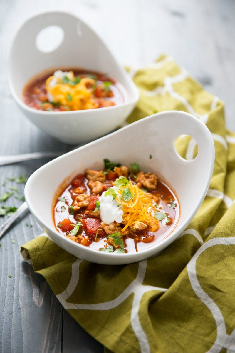 Spicy Turkey Chili recipe from RecipeGirl.com #spicy #healthy #turkey #chili #weight #watchers #weightwatchers #ww #wwfreestyle #recipe #RecipeGirl Bowls of Spicy Turkey Chili