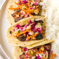 three thai beef tacos