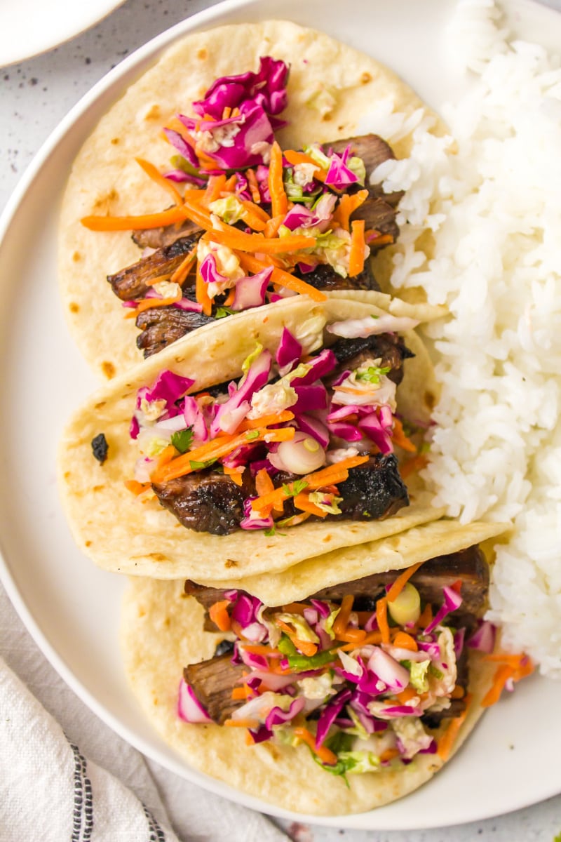 three thai beef tacos