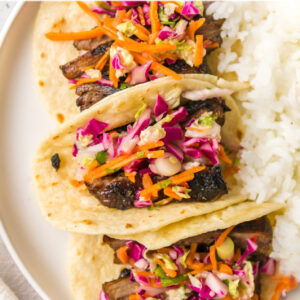 pinterest image for thai beef tacos