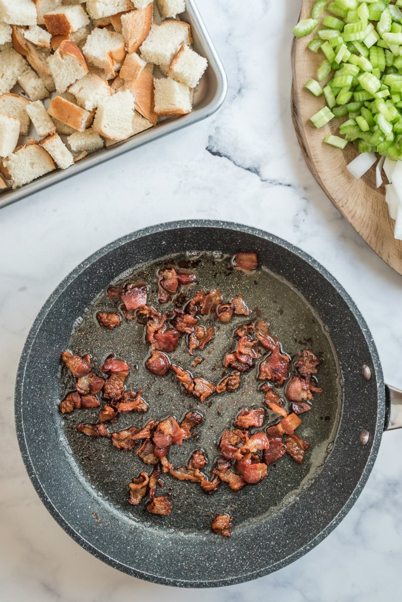 chopped bacon cooking in skillet
