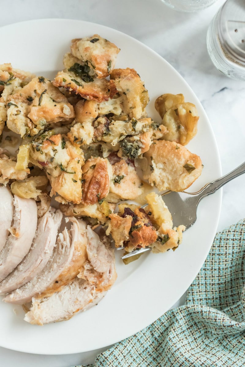 dressing served on a white plate with sliced turkey