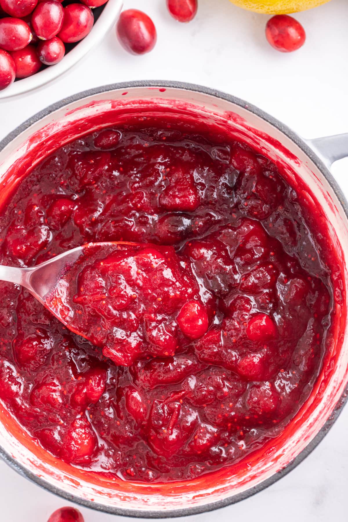 pot of fresh cranberry jam with a spoon