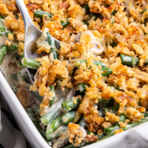 spooning out fresh green bean casserole