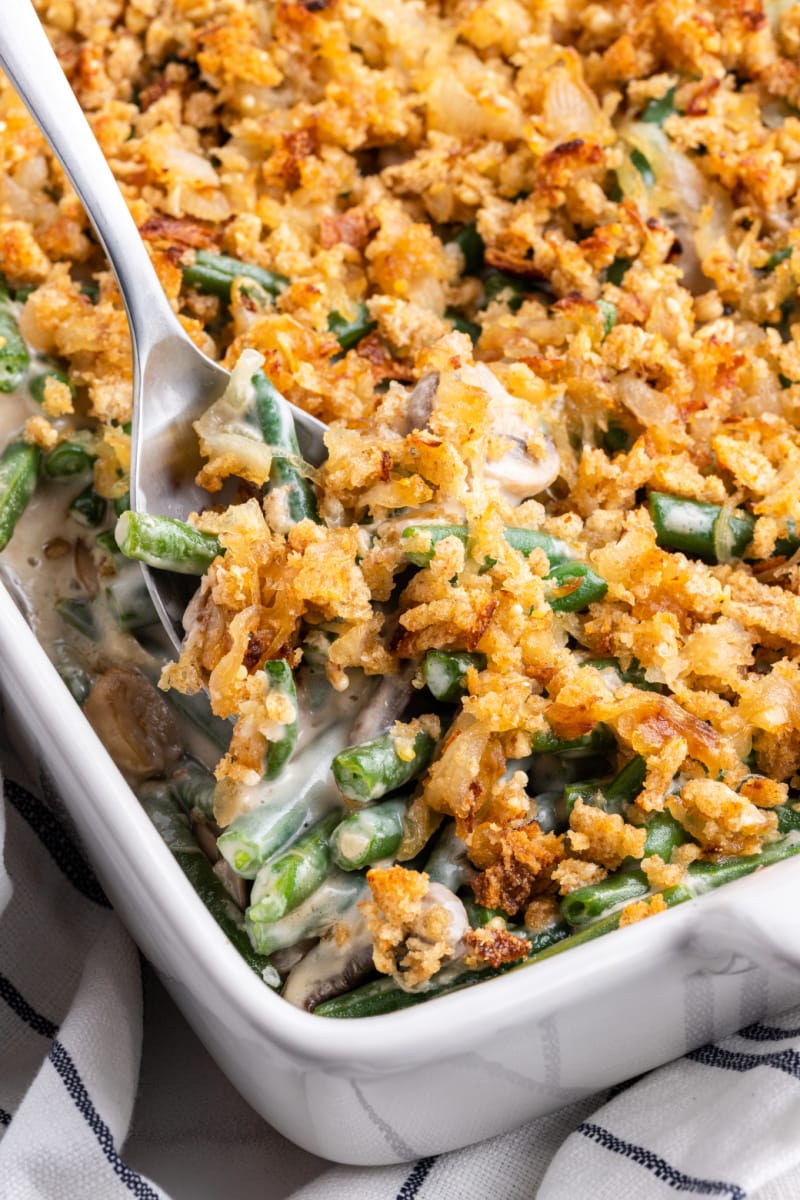 spooning out fresh green bean casserole