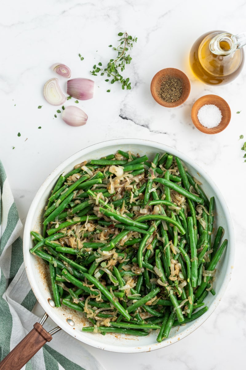 bowl of green beans with caramelized shallots