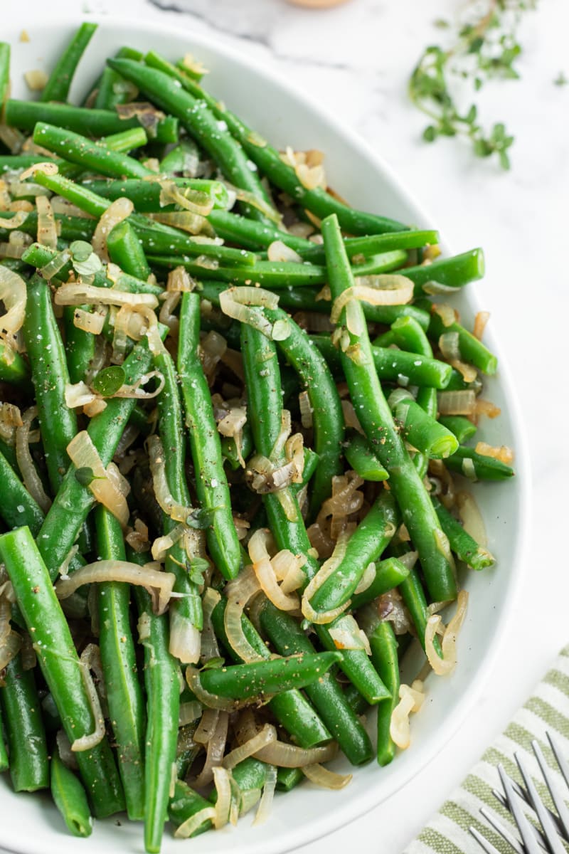 bowl of green beans with caramelized shallots