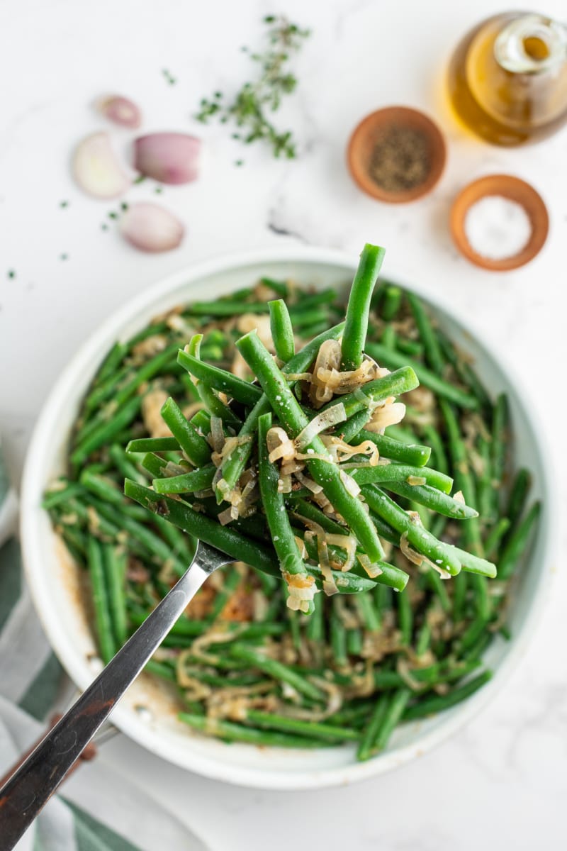 bowl of green beans with caramelized shallots