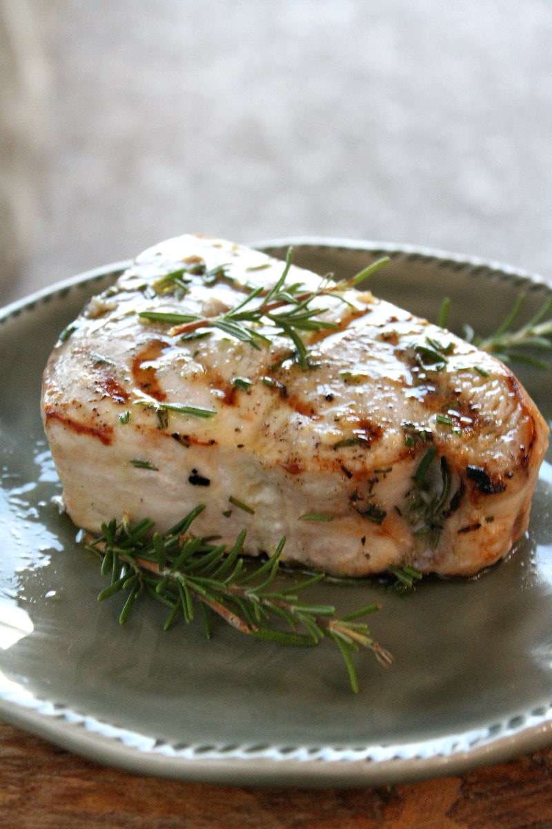 Grilled Swordfish with Rosemary on a gray plate