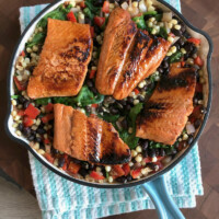 lime and honey glazed salmon in a skillet