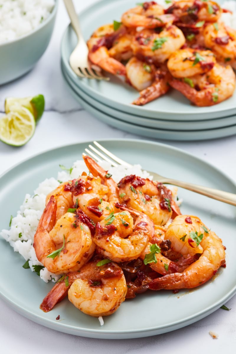 pan seared shrimp with chipotle lime glaze served with rice on a plate