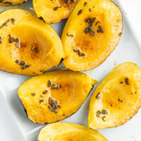 roasted winter squash wedges on a platter