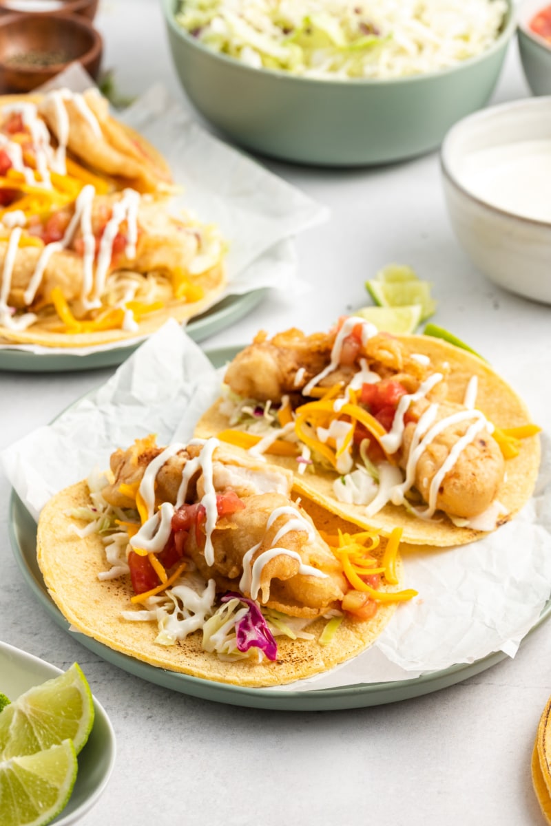 two san diego style fish tacos on a plate