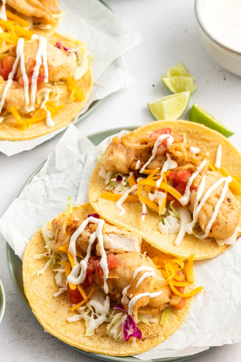 two san diego style fish tacos on a plate