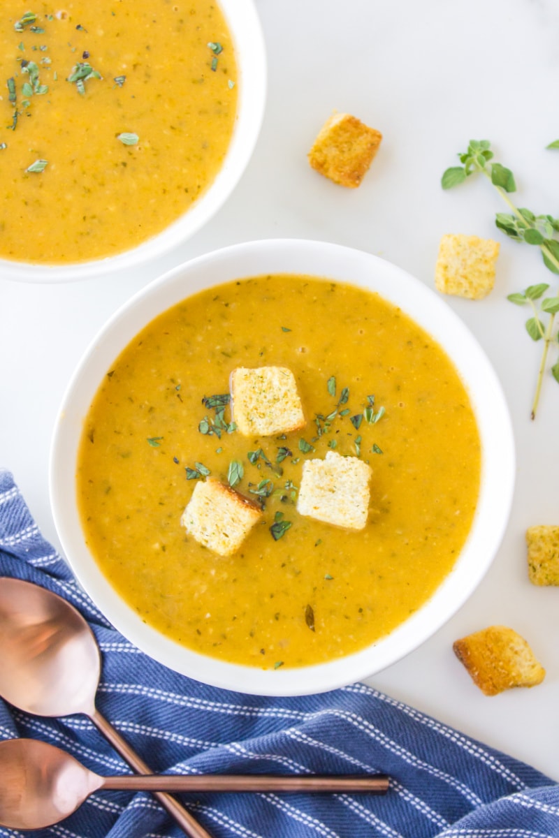 bowl of zucchini fresh oregano soup topped with croutons