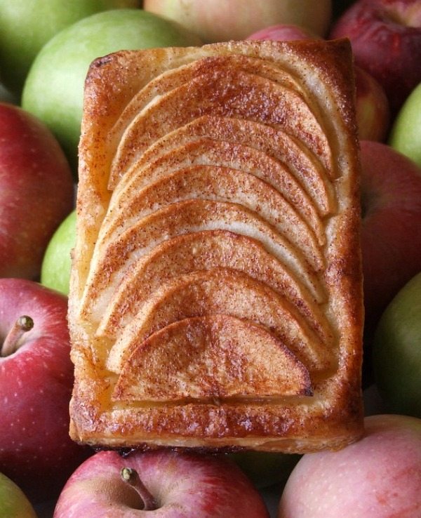 Maple Apple Tartlet on a bed of fresh green and red apples