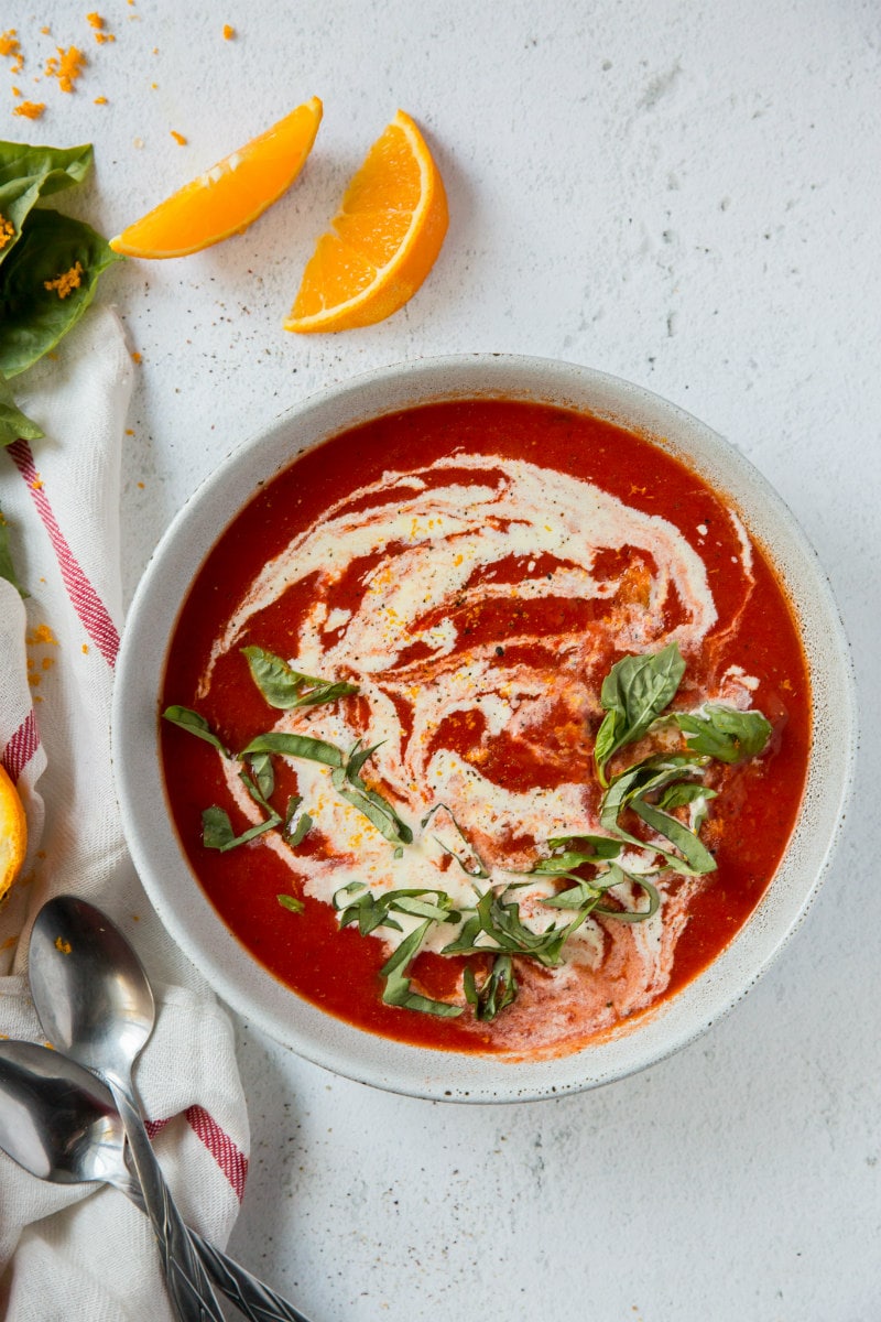 Roasted Red Pepper Soup garnished with cream and basil