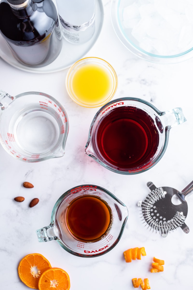 ingredients displayed for making amaretto cranberry kiss cocktails