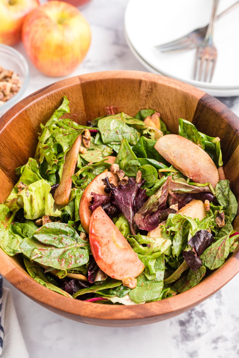 wooden salad bowl of apple walnut salad