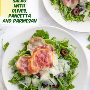 pinterest image for arugula salad with olives pancetta and parmesan