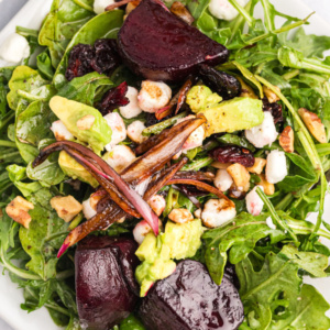 pinterest image for beet and goat cheese arugula salad