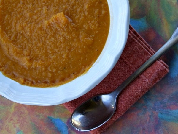 Roasted Butternut Squash Soup with Apples in a white bowl