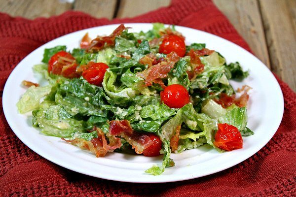 Caesar Salad with Pancetta and Roasted Tomatoes recipe from RecipeGirl.com Caesar Salad with Pancetta and Roasted Tomatoes on white plate