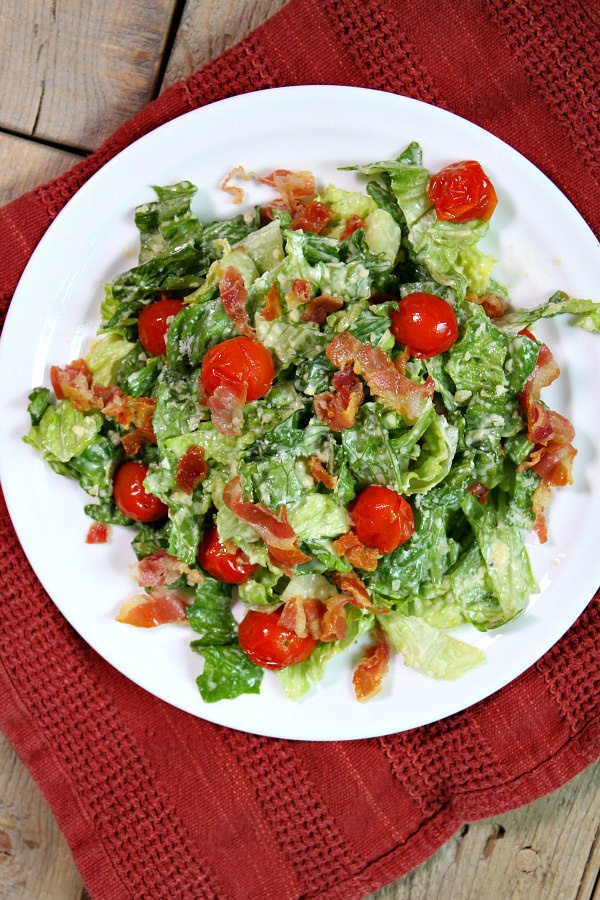 Caesar Salad with Pancetta and Roasted Tomatoes recipe from RecipeGirl.com Caesar Salad with Pancetta and Roasted Tomatoes on white plate