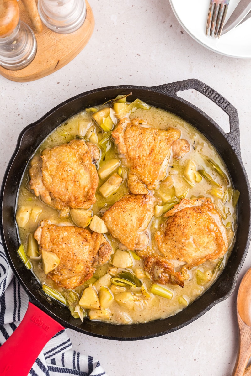 chicken, leek and apple stew in a skillet