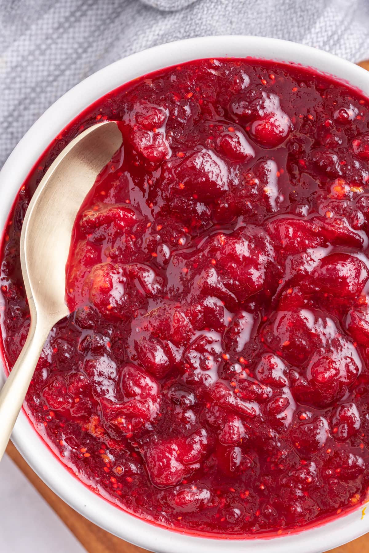 classic cranberry sauce in a bowl with a spoon