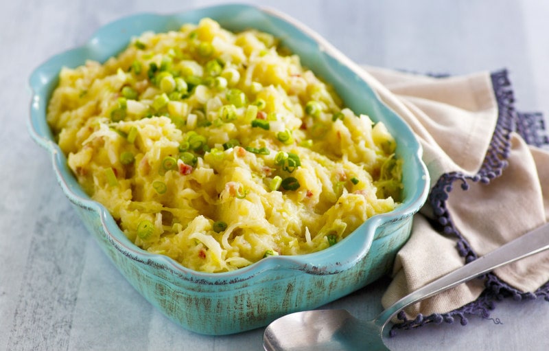 Traditional Irish Colcannon recipe from RecipeGirl.com #traditional #irish #colcannon #mashed #potato #potatoes #stpatricksday #recipe #RecipeGirl Colcannon in blue casserole dish