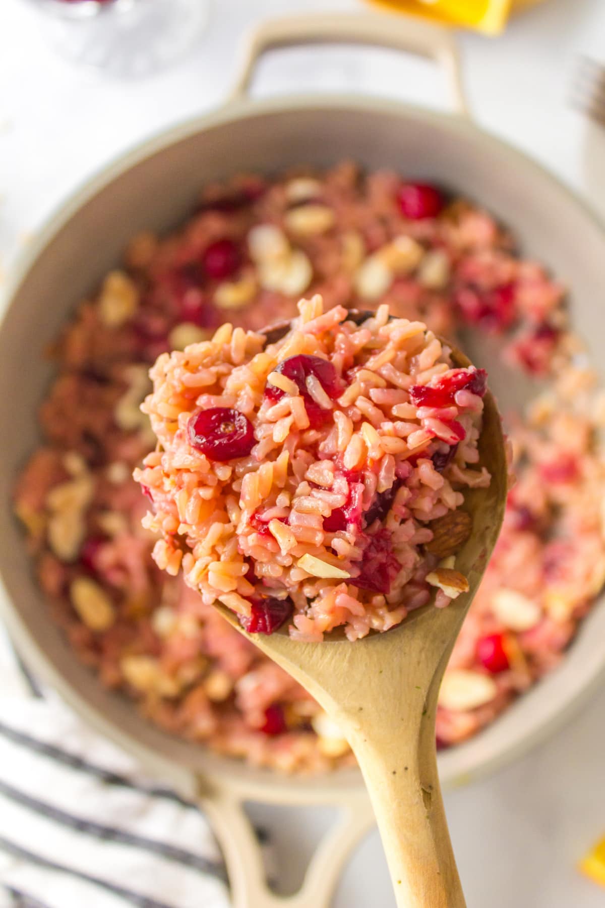spooning out cranberry rice pilaf