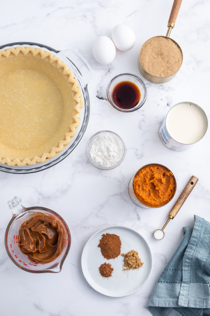 ingredients displayed for making dulce de leche pumpkin toffee pie