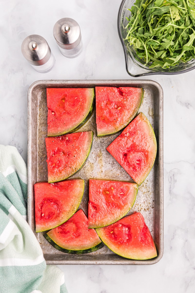 grilled watermelon slices on baking sheet