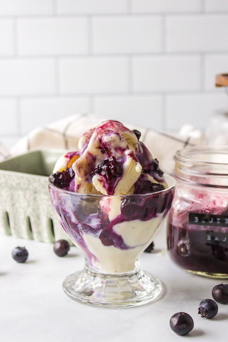 hot blueberry sauce topping ice cream in dish