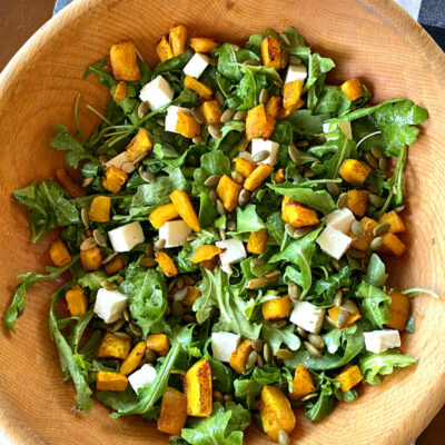 maple roasted pumpkin salad in a wooden bowl