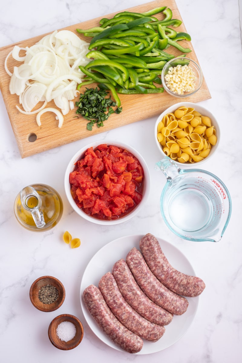 ingredients displayed for making sausage and pepper stew