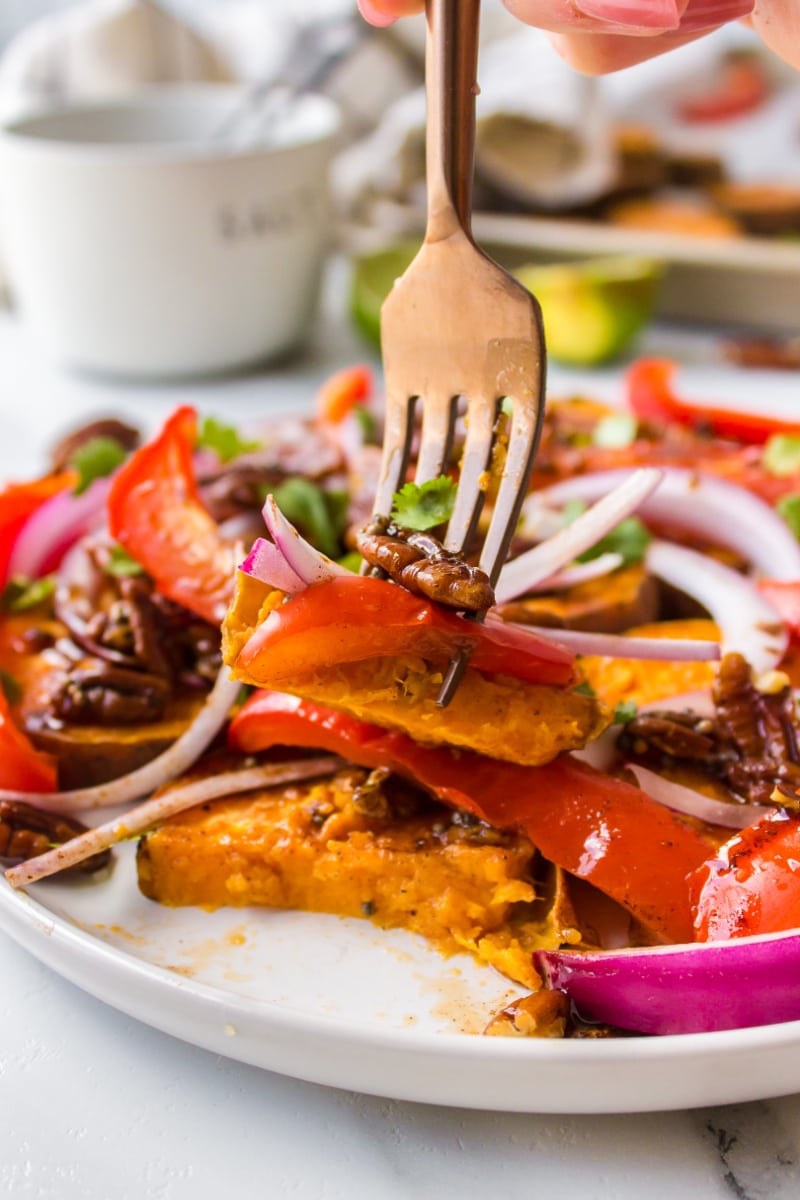 fork full of yam and pecan salad