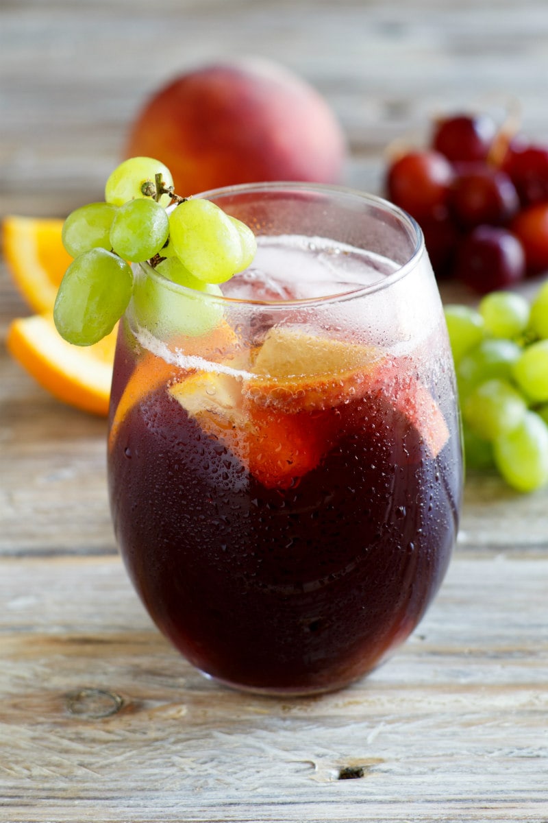 Glass of Grape Sangria garnished with green grapes