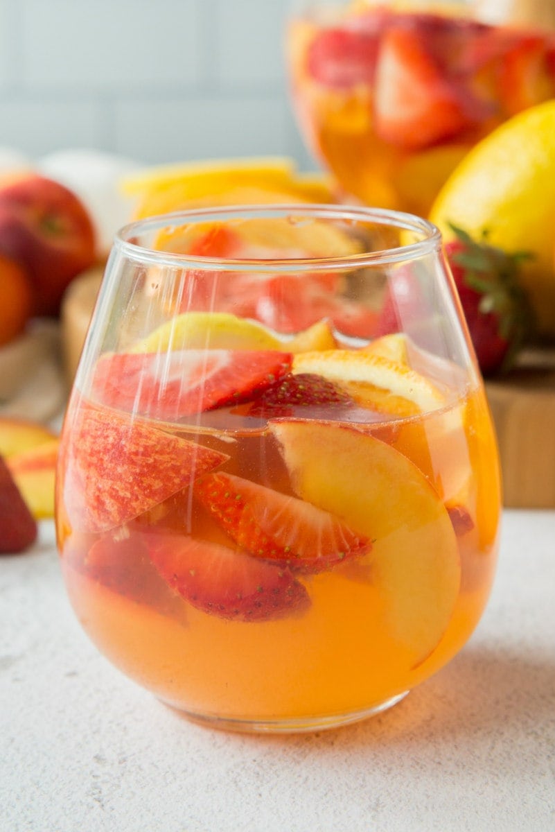 glass of strawberry peach sangria