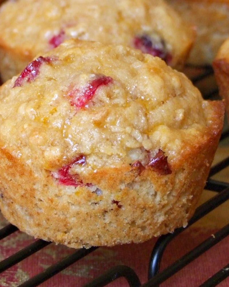 whole grain cranberry muffin on a cooling rack