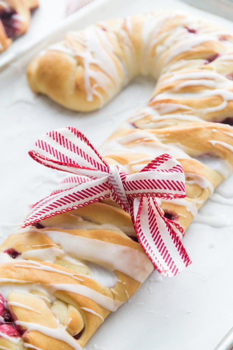 adding a bow to a holiday coffee cake