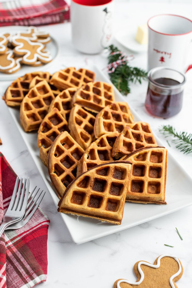 gingerbread waffles broken up into wedges displayed on white platter