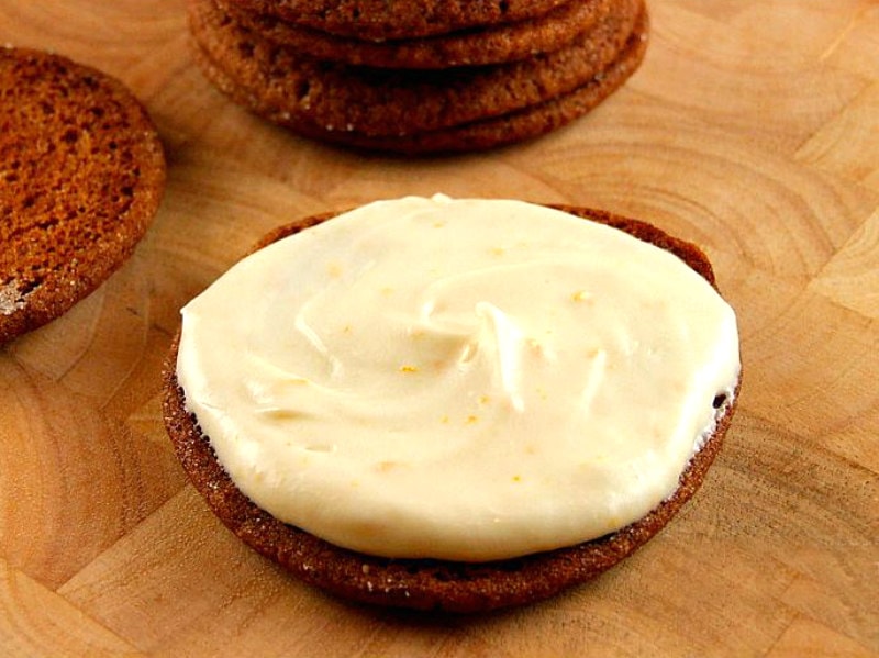 orange cream spread onto gingersnap