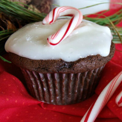 chocolate cupcakes with peppermint icing and a candy cane on top
