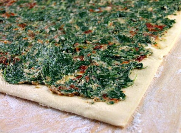 puff pastry with spinach and sundried tomato spread on top