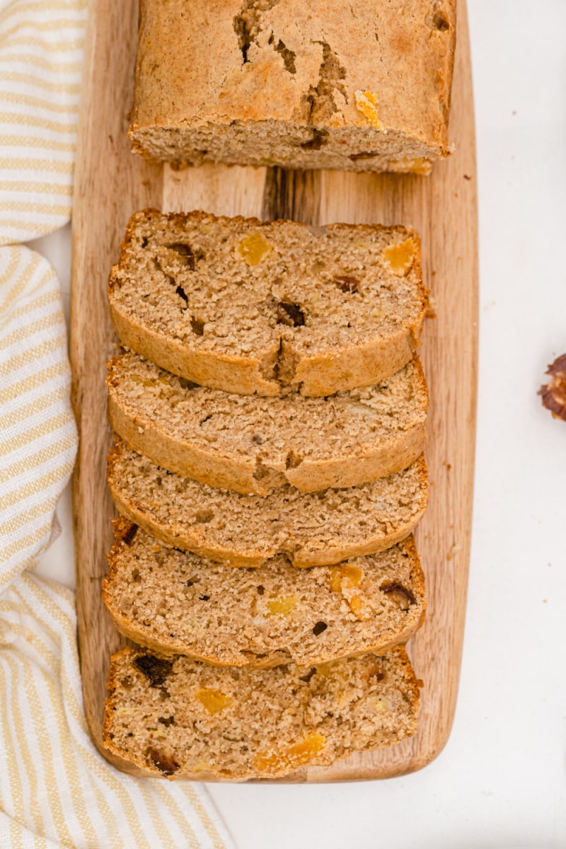 healthy whole wheat banana bread sliced on board