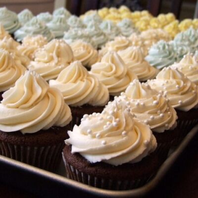 tray full of wedding cake cupcakes